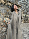 Woman wearing a greige A-line kurta set with dupatta by Afeemi