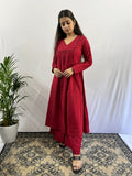 Woman wearing Afeemi's Rooh maroon kurta set with palazzo